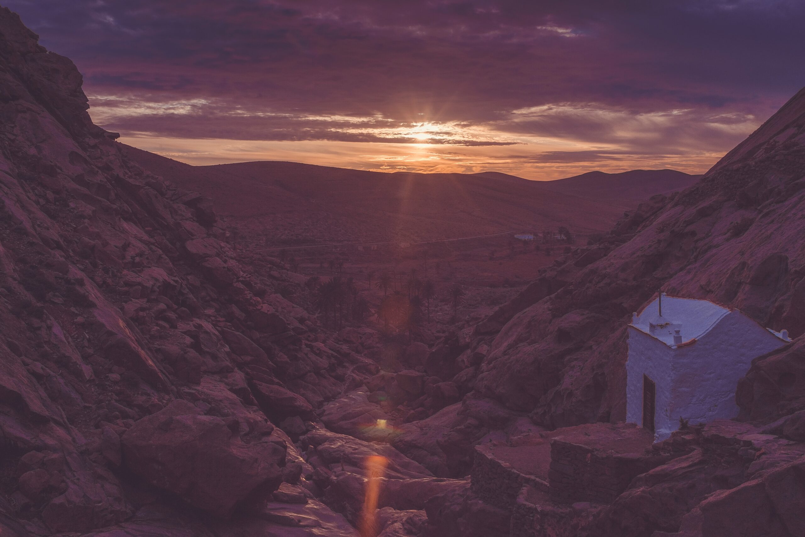 white house on mountain during orange sunset